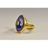 A George V 18ct gold lapis lazuli seal stamp ring, oval lapis lazuli panel carved with,