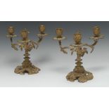 A pair of 19th century Rococo Revival gilt bronze three-light candelabra,