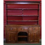 A large 19th century pine farmhouse kitchen dresser,