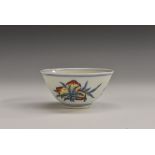 An 18th century Chinese tea bowl, the exterior with fruit sprigs, in blue,