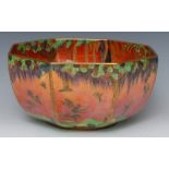 A Wedgwood flame Fairyland Lustre octagonal bowl, designed by Daisy Makeig-Jones,