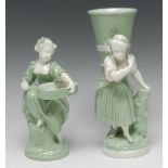 A Minton celadon figural spill vase, modelled as a rustic girl carrying a wicker basket,