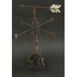 A 19th century cast metal weather vane, triform base cast with winged liver birds,