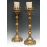 A substantial pair of late 19th century ecclesiastical brass alter candle sticks
