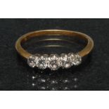 A diamond quintet line ring, linear set with five graduated round old cut diamonds,