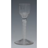 An English cordial glass, bucket shaped bowl, cotton twist stem, spreading circular base, 14cm high,