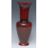 A large Bernard Moore flambé ovoid vase, with flared neck, decorated with scrolling foliage,