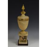 A Neo-Classical design gilt metal mounted Derbyshire fluorspar and alabaster urn, pine cone finial,
