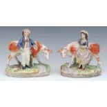 A pair of Staffordshire models, of a milkmaid and milk boy, standing before cows, oval bases,