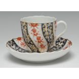 A Chelsea-Derby Queen Charlotte pattern wrythen-fluted coffee cup and saucer,