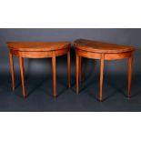 A pair of George III mahogany demi-lune card tables,