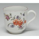 An early Derby coffee cup, painted in the manner of the Cotton-stem Painter with polychrome flowers,