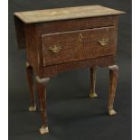 A late 18th century oak lowboy, with drop-leaf, deep drawer to frieze, cabriole legs, 70cm high,