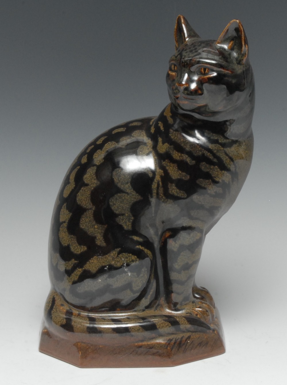 Charles Vyse (1882-1971) - a stoneware model of a seated tabby cat, Tamoku glaze,