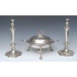 A pair of silver plated candlesticks, campana shaped sconces, tapering column, shaped bases,