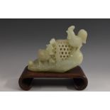 A Chinese jade incense burner, carved as a cockerel, hen and chicks beside a basket,