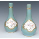 A pair of English porcelain Sèvres style bottle vases and covers,