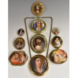 A continental porcelain oval painted panel brooch, Madonna peering aloft,