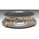 A Victorian EPBM circular cake plateau, mirrored field, concave border embossed with fruiting vine,