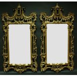 A pair of Chinese Chippendale Revival pierced and moulded giltwood looking glasses,
