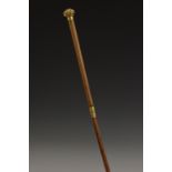 A gilt metal mounted lady's riding crop, the domed pommel chased with scrolling foliage, 70.