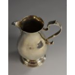 A George III silver sparrow beak cream jug, scroll capped handle, domed foot, 9.