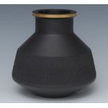 A Wedgwood black basalt vase, designed by Robert Minkin, with textured band, gilt line rim,