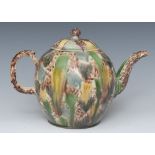A Whieldon globular teapot, dripped and splashed in green, yellow and manganese, crabstock handles,
