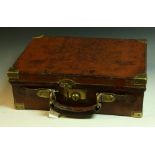 A 19th century brass bound leather cartridge case, the interior divided into six sections,