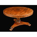 A William IV rosewood circular centre table, moulded top with book-matched veneers,