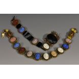 An unusual multi colour high relief cameo choker necklace, composed of ten carved panels in blue,