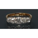 A late Victorian diamond quintet ring, central old cut diamond approx 0.
