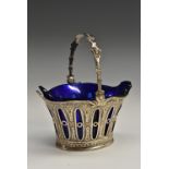 A late 19th century Dutch silver sweetmeat basket, swing handle, blue glass liner, 11.