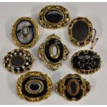 Brooches - a 19th century hair work mourning brooch, seed pearl floral motif, black enamel ground,