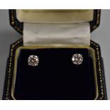 A pair of diamond stud earrings, each round brilliant cut diamond approx 0.