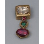 An 17th/18th century gold coloured metal pendant, set with an old cut diamond, above a ruby,