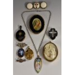 A mother of pearl and black stone inlaid cross brooch,