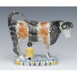 A 19th century Pearlware cow creamer, possibly Yorkshire, standing four square,