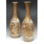 A pair of large Japanese satsuma slender ovoid vases, densely painted and gilt with samurai,