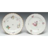 A Chelsea-Derby shaped circular plate, painted in polychrome enamels with scattered ripe fruits,