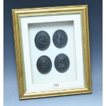 A set of four Wedgwood black basalt oval portrait plaques, Socrates, others, each 6cm high,