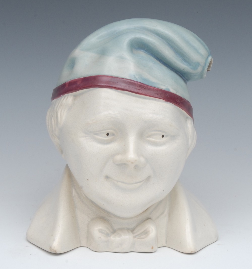 A Stoneware novelty warming jug, as a gentleman wearing a night cap, 19cm high, c.