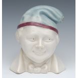 A Stoneware novelty warming jug, as a gentleman wearing a night cap, 19cm high, c.