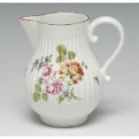 A Derby baluster cream jug, moulded in relief with a ribbed frieze,
