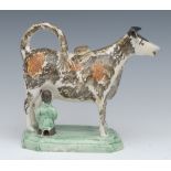 A 19th century cow creamer and cover, standing four square, with milkmaid,