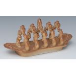 A Brampton Derbyshire brown salt glazed stoneware five bar toast rack, scroll divisions,