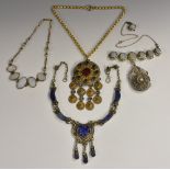 Necklaces - a white metal filigree and opaline glass pendant necklace,