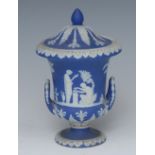 A Wedgwood Blue Jasper campana shaped vase and cover, sprigged in white with classical figures,