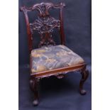 A Chippendale design mahogany side chair, the back with shaped cresting rail,