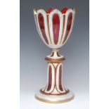 A 19th century Bohemian ruby glass goblet on pedestal, fluted bowl,